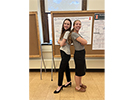 Girl power: Morgan and Maria at the undergraduate research poster session, August 2022